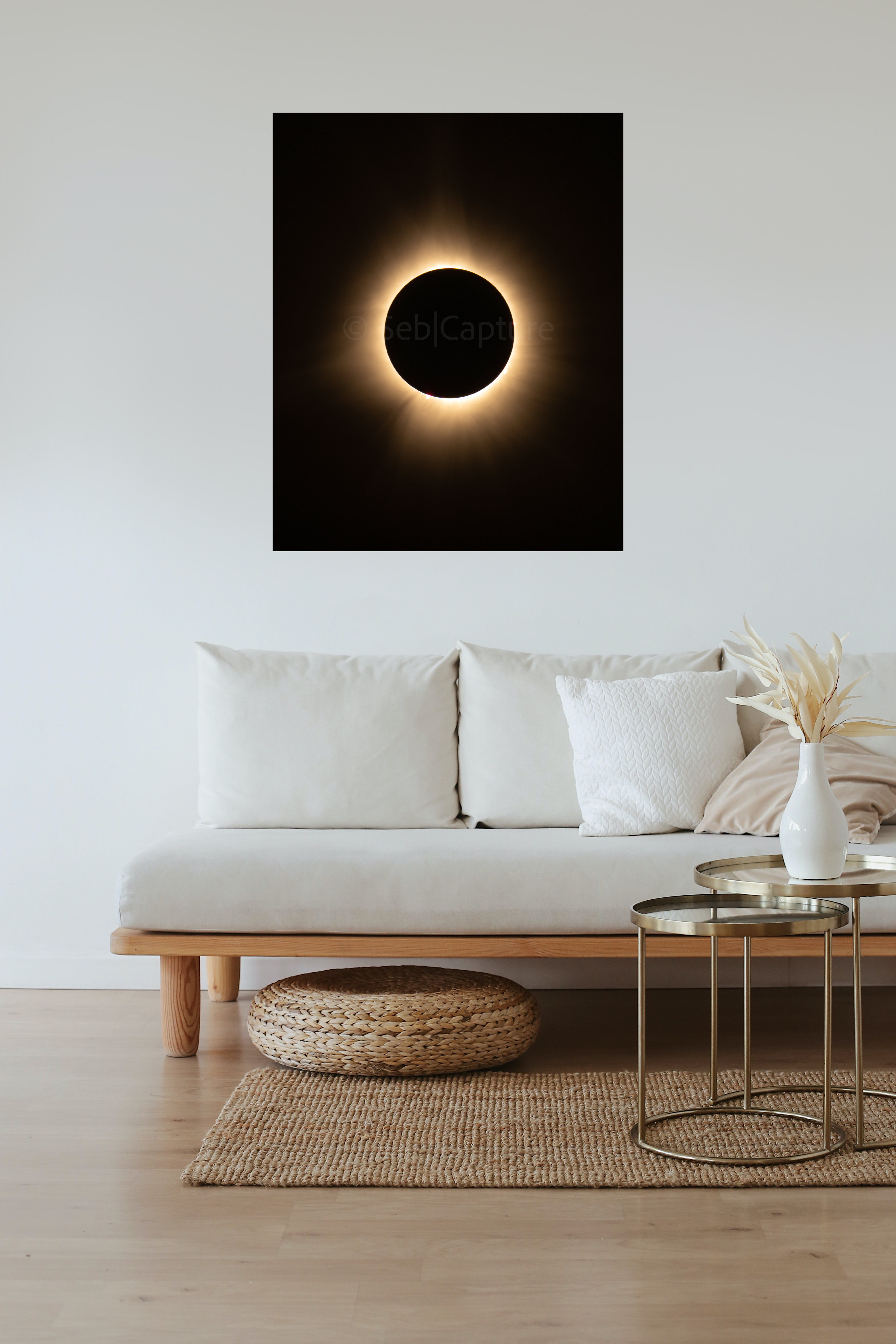 Photo of a solar eclipse on the wall of a living room